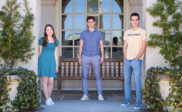 Goldwater Scholars for 2021-22: (from right to left): Samuel Schwartz, Joseph McCalmon, and Ashley Peake posing on WFU campus on 3/29/21